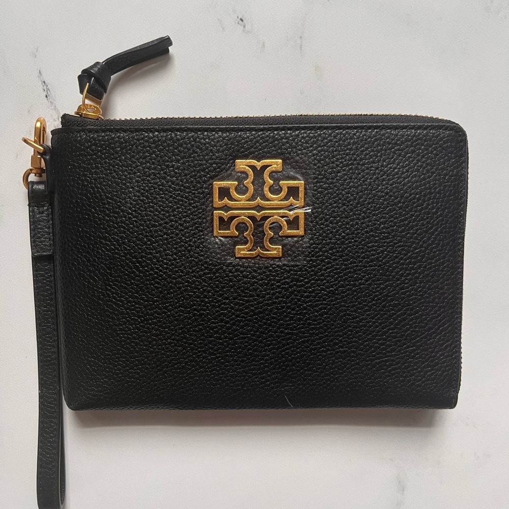 NEW Tory Burch Black Wristlet with Gold Logo never been used.
